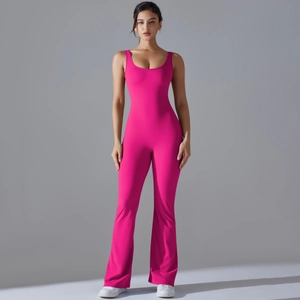 Detailed full view of hot pink flare leg yoga bodysuit with cutout back design