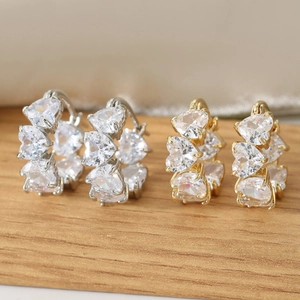 Elegant heart-shaped zircon hoop earrings in gold and silver finish with crystal inlay