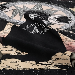 Bohemian black tapestry featuring sun, moon, and prayer hands with intricate details