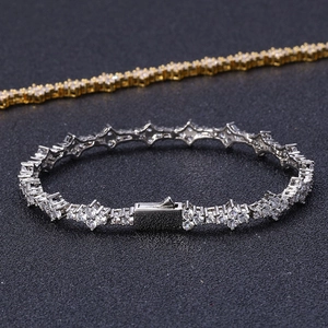 Macro shot of silver hip hop bracelet with clear pavé zircons and clasp detail