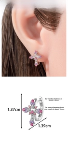Detail view of colorful cross hoop earrings with precise dimensions 1.37cm by 1.39cm