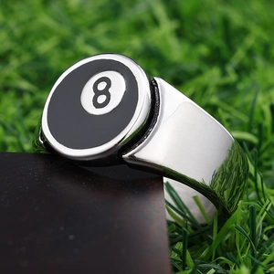 Vintage stainless steel men's ring with billiard 8 ball design on green grass