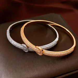 18K gold plated minimalist bangle with horseshoe buckle and sparkling zircon pavé