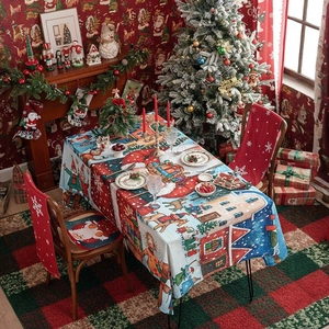 Christmas tablecloth set with Santa, reindeer patterns and matching red chair covers