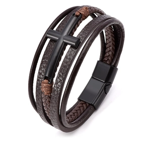 Detail of multi-layer braided leather bracelet with black cross and magnetic clasp