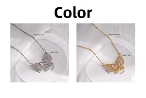 Macro detail of butterfly necklaces in gold and silver finish with zircon micro-pave