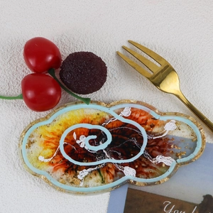 Artistic cloud shaped resin tray with gold foil and marble swirl texture detail