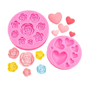 Pink silicone fondant mold set featuring various sizes of rose flowers and heart shapes