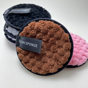 Set of colorful reusable microfiber cleansing sponges for gentle makeup removal