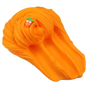 Detailed view of orange butter slime texture with a cute carrot charm and smiley face decoration