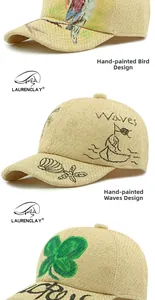 Detailed view of woven straw baseball caps featuring hand-painted bird and wave patterns