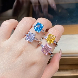 Set of four S925 silver rings with colorful radiant cut zircon stones worn together