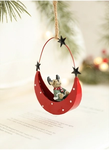 Detail of red crescent moon iron ornament with a cute reindeer and rustic hemp rope