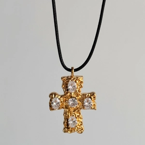 Detail of 18k gold plated cross pendant with five clear crystals on black cord necklace