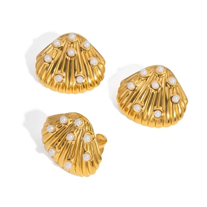 Golden shell jewelry set with white pearls including earrings and matching ring