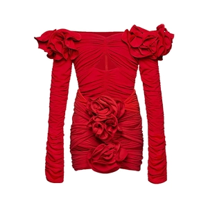 Detail of red off-shoulder mini dress featuring 3D rose flowers and ruched fabric texture