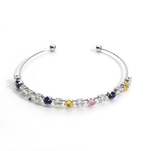 Elegant silver open cuff bracelet featuring multi-colored cubic zirconia gemstones