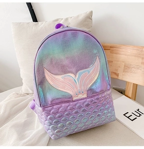 Detail of laser mermaid backpack featuring iridescent scales and pink tail embroidery