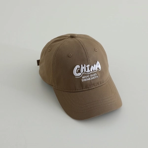 Close-up of brown cotton baseball cap with white CHINA 3D embroidery and curved brim