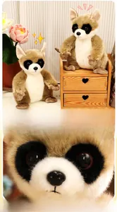 Close-up of the plush raccoon toy with large sparkling acrylic eyes and soft fur detail