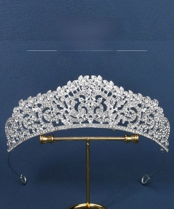 Detail showing elegant silver alloy bridal crown with intricate rhinestone floral patterns