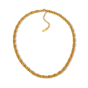 Golden 18K plated stainless steel necklace with spiral chain links on a white backdrop