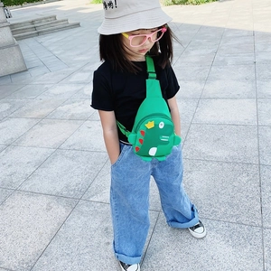 Cute green dinosaur chest bag for kids with yellow crown detail and adjustable strap