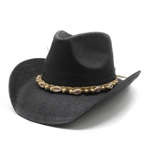 Detail of black straw cowboy hat featuring woven band with shells and wooden beads