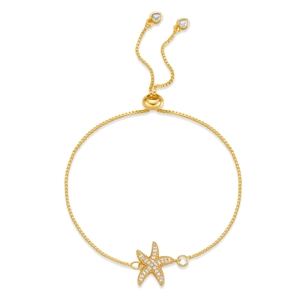 Detail of adjustable gold-plated starfish bracelet with box chain and zircon accents