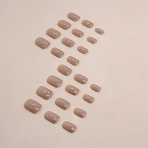 Short square coffee brown press-on nails with a glossy nude finish and 24 pieces set