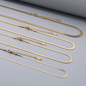 Detail of five gold stainless steel herringbone chains in different widths with lobster clasps