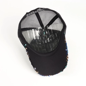 Detail of black mesh baseball cap featuring vibrant multi-color sequins on the brim
