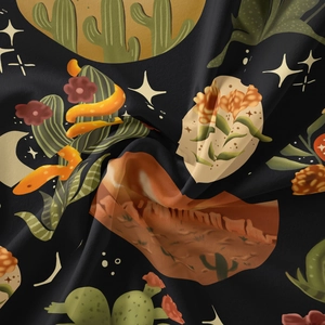 Macro shot of vintage black fabric with moon and desert illustrations for room decor