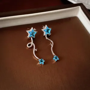 Elegant star tassel earrings with blue zircon crystals and silver fringe for women