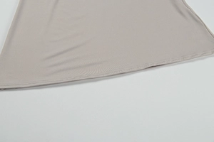 Macro shot of double-needle stitching and high-density knit fabric on a slim garment hem