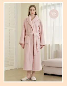 Detailed texture of thick baby pink fleece robe with contrast faux shearling collar trim