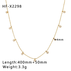 Macro view of 18k gold plated titanium necklace with 4mm white zircon stone specs