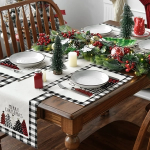 Detailed view of Christmas placemat with Merry Christmas text on a festive wooden table