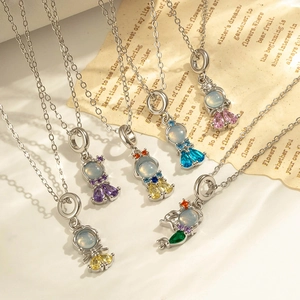 Colorful astronaut pendant necklaces with opal heads and vibrant gemstones on vintage background