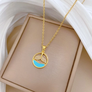 Gold titanium steel necklace with fish tail pendant and blue enamel wave inside a circle