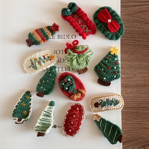 Handmade crochet Christmas hair clips with tree, stocking, and gift box designs