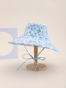 Detail of floral sun hat with adjustable chin strap showing pink and blue patterns
