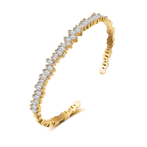 Detail view of gold geometric open bracelet featuring rectangular zircon inlay craftsmanship