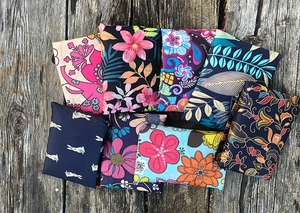 Flat lay of foldable oxford fabric shopping bags with various artistic floral patterns