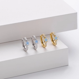 Detail of s925 silver star earrings with light blue enamel and micro-pave zirconia