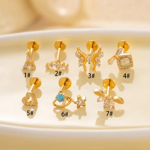 Set of 7 gold G23 titanium cartilage earrings with butterfly and zircon stones