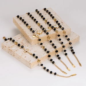 Stainless steel beaded bracelets with cross and heart charms on beige stone