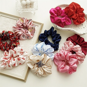 Detailed collection of satin silk scrunchies in solid colors and floral printed patterns