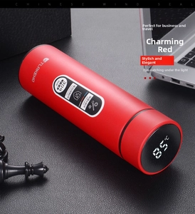 Close-up of smart vacuum flask LED lid showing 85°C temperature on red stainless steel