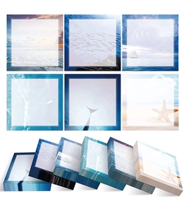 Macro shot showing six ocean-themed self-adhesive sticky notes with wave and whale patterns